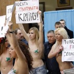 Topless Protesters Break into Invitation-Only Gathering