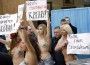 Topless Protesters Break into Invitation-Only Gathering